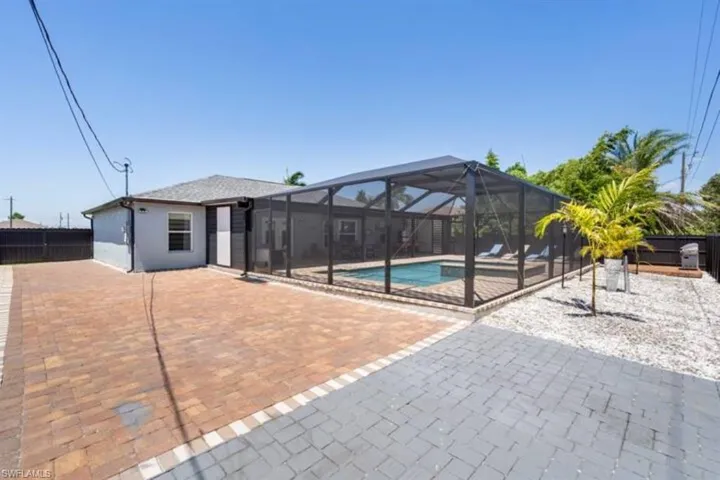 View of pool featuring a patio and a lanai