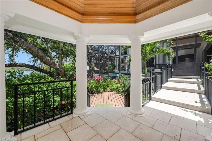 Charming gazebo with custom wood ceiling; this space is perfect for al fresco meals at dusk!