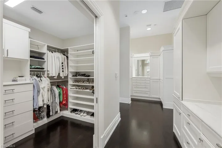 The redesigned primary closet offers more than enough room for both of you.