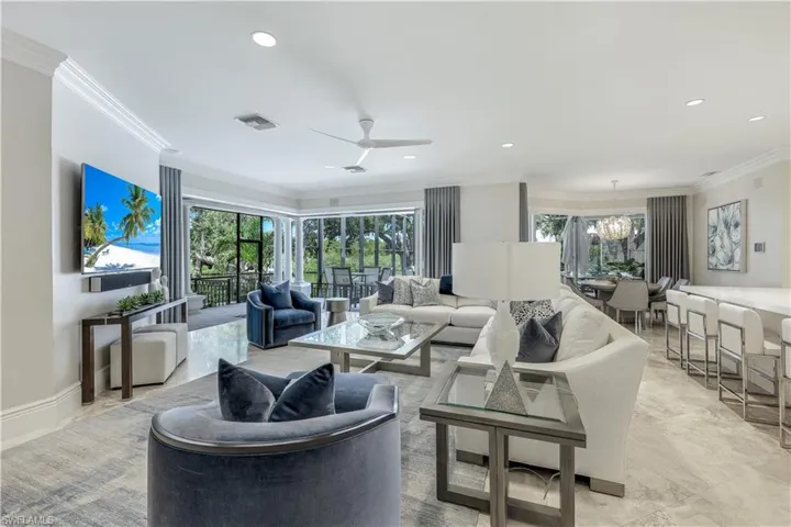 The informal "great room" opens to the large outdoor living space.