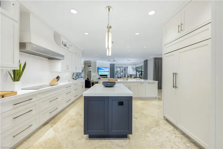 Miele dishwashers, custom cabinetry, and a spacious center island - the perfect spot to create delicious meals for all to enjoy.