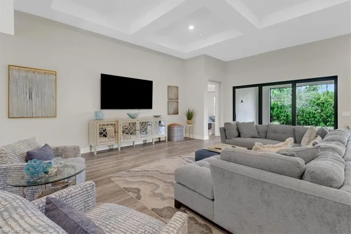 floors, beamed ceiling, and coffered ceiling