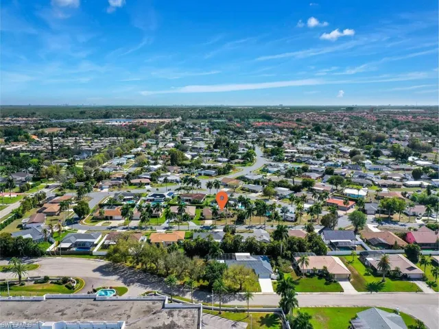 Aerial overview of property's location featuring nearby suburban area