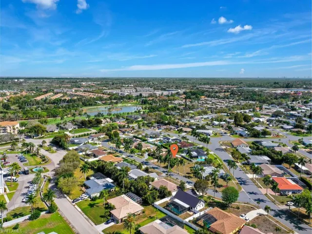 Aerial perspective of suburban area with a large body of water