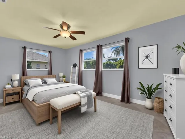 Bedroom with baseboards and ceiling fan