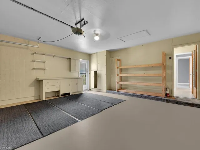 Garage featuring a garage door opener