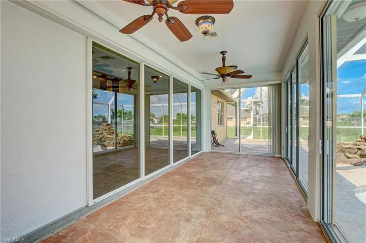 sunroom featuring ceiling fan