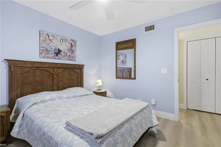 Bedroom featuring light wood-finish flooring and light blue wall tones