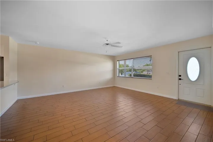 Entryway featuring wood finished floors and ceiling fan