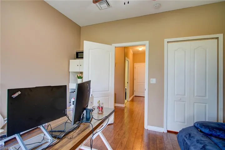 The only bedroom downstairs, currently an office
