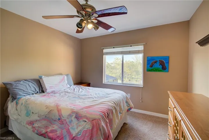 A good sized bedroom with large windows