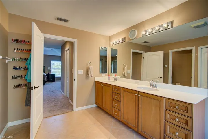 Dual vanity with plenty of cabinet and counter space