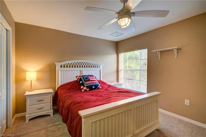 A good sized bedroom with a large window