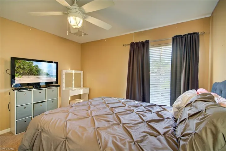 A good sized bedroom with large windows