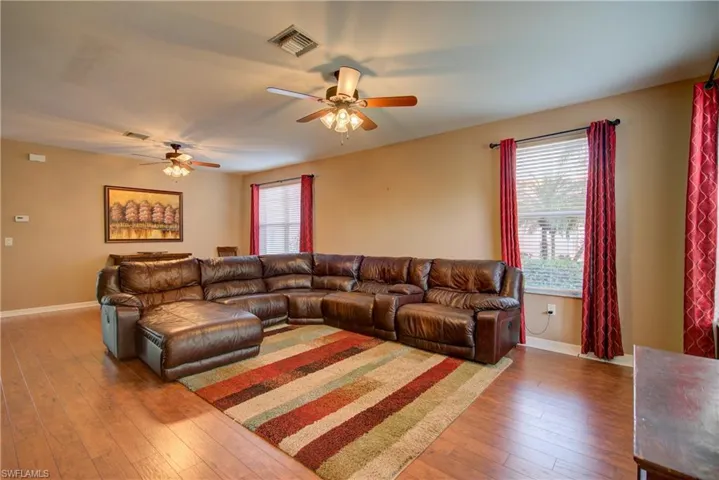 This living room is expansive at 26' x 18' (includes a secondary 18' x 9' dining area behind the couch)
