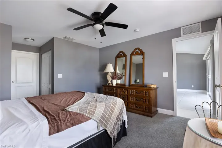 Primary Carpeted bedroom with a closet and ceiling fan