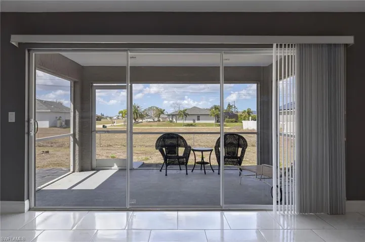 Patio/Lanai with a view of the backyard.