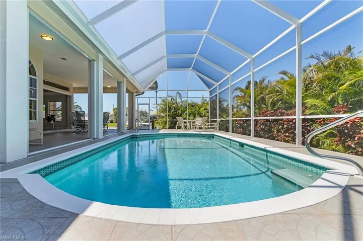 Outdoor pool with a patio area and a lanai