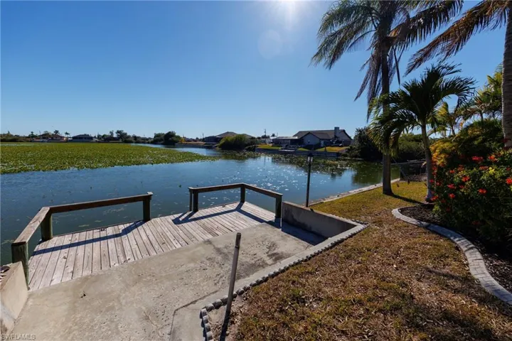 Dock area featuring a water view