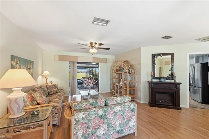 Living room with a ceiling fan and wood finished floors