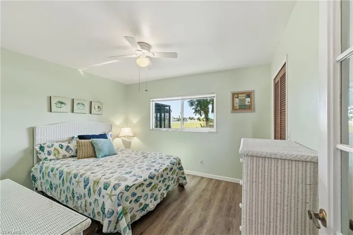 Bedroom with wood finished floors and ceiling fan