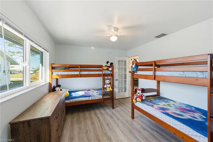 Bedroom featuring light wood-style floors and a ceiling fan