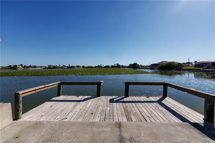 Dock area featuring a water view