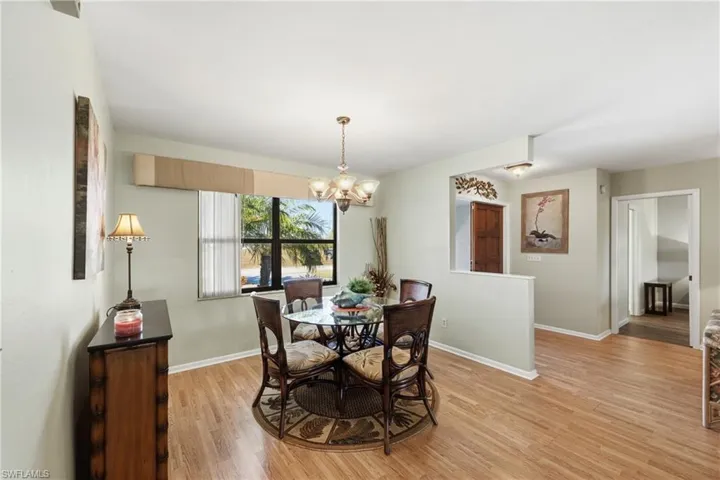 Dining space with a chandelier and light wood-type flooring