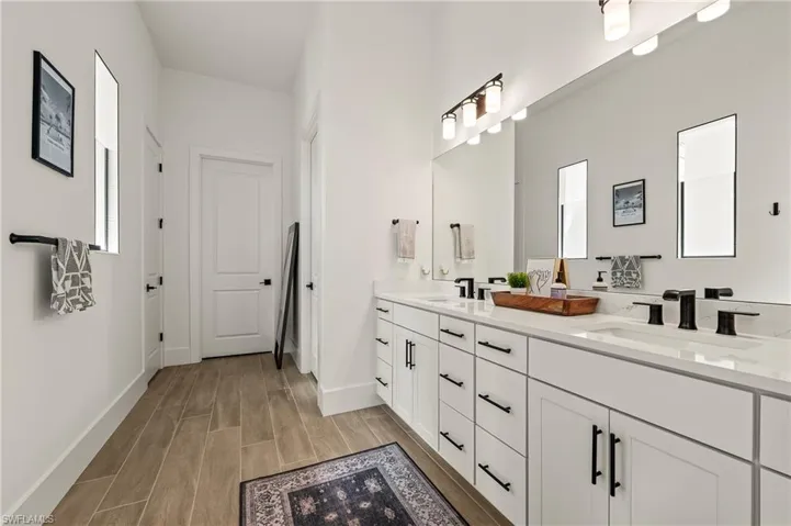 Quartz countertops, double-sink vanity, linen closet