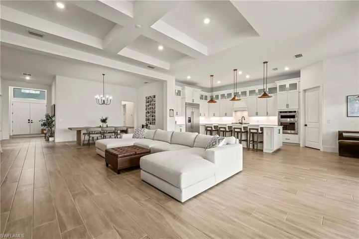Open Gathering Room with Dining Area and Kitchen