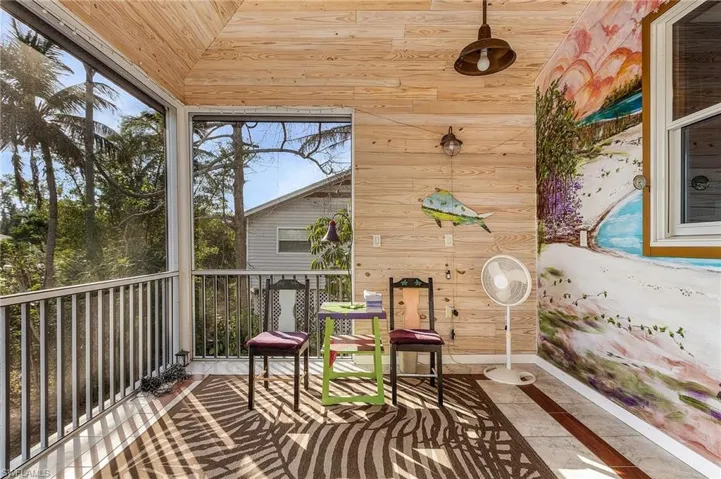 Sunroom featuring wooden ceiling