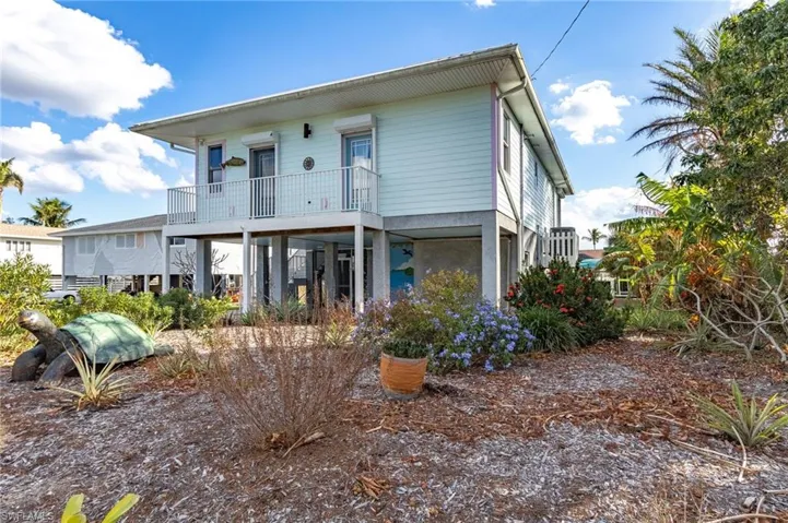 View of front of house featuring a balcony