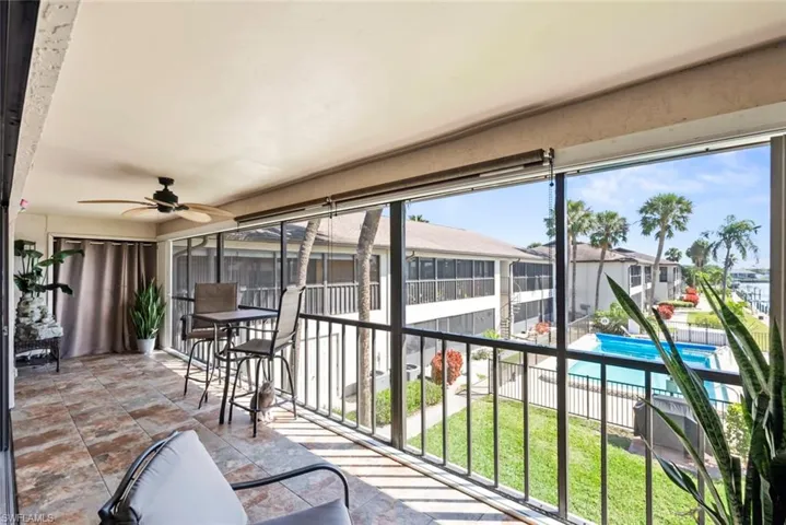 Sunroom with a ceiling fan