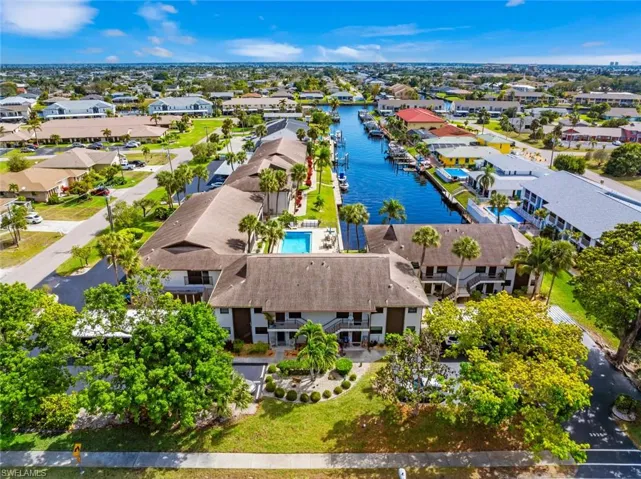 Drone / aerial view featuring a residential view and a water view
