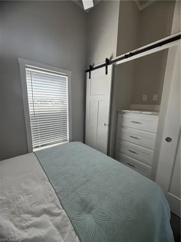 Bedroom with a barn door