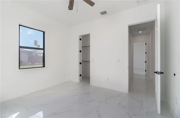 Unfurnished room with ceiling fan