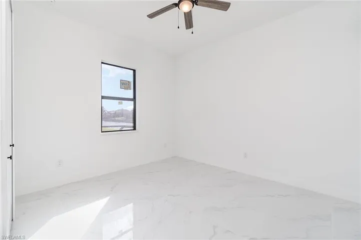 Unfurnished room with ceiling fan