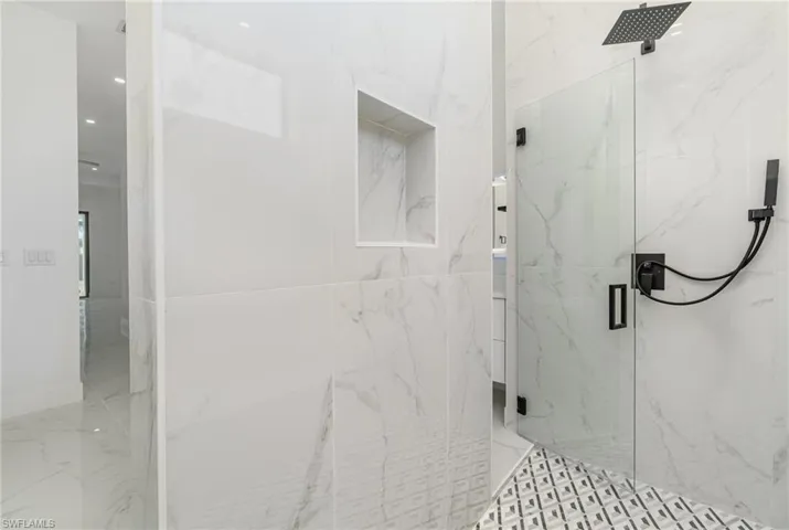 Bathroom with a shower with door