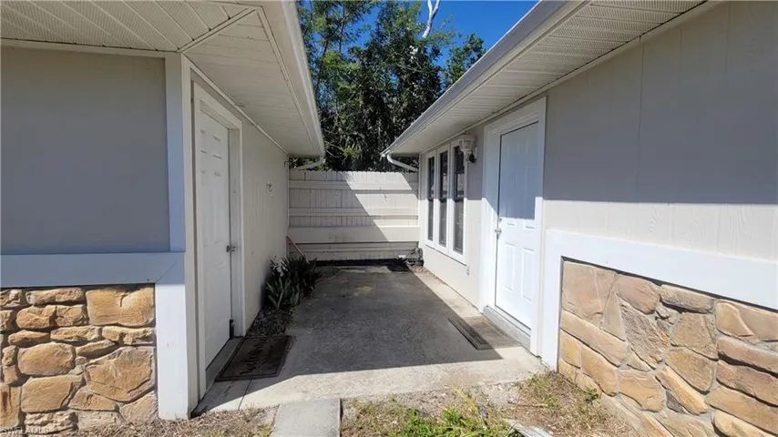 Patio between front door and garage
