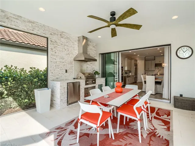 Dining area featuring ceiling fan and light tile patterned flooring