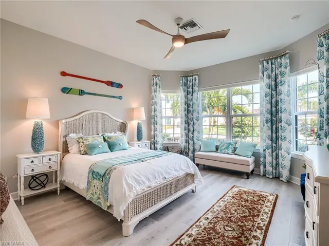 Bedroom featuring light hardwood / wood-style flooring and ceiling fan