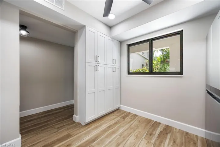 Unfurnished bedroom with light wood finished floors and a closet