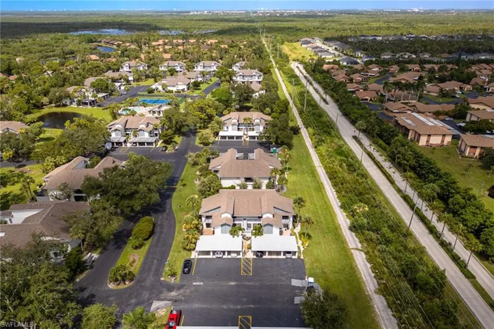 Aerial overview of property's location featuring nearby suburban area and a large body of water