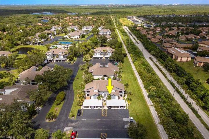 View of property location featuring nearby suburban area and a large body of water