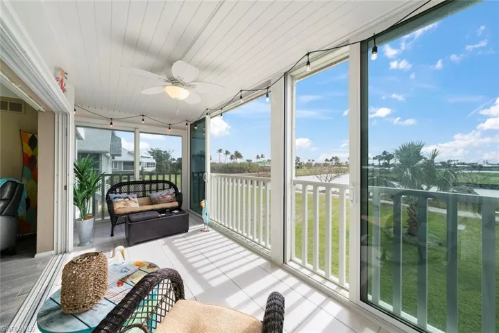 Sunroom / solarium featuring ceiling fan and a wealth of natural light