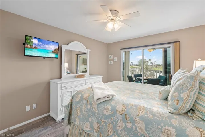 Bedroom featuring ceiling fan and access to outside