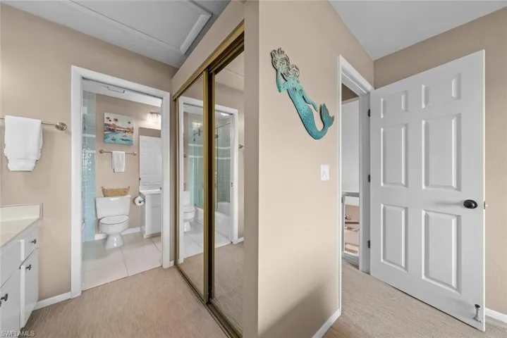 Hallway featuring light tile patterned floors