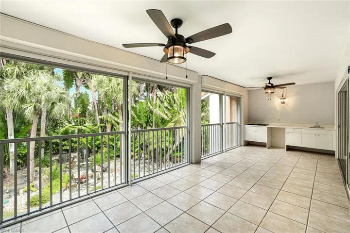 LANAI FEATURING ELECTRIC STORM SHUTTERS AND UPGRADED CEILING FANS
