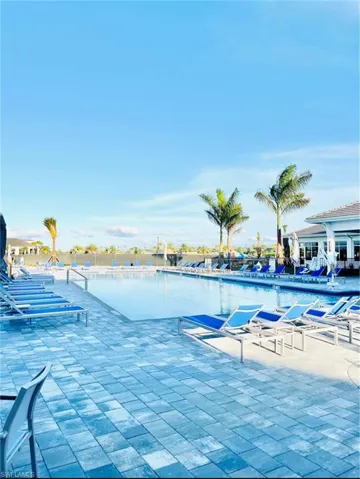 Community pool featuring a patio