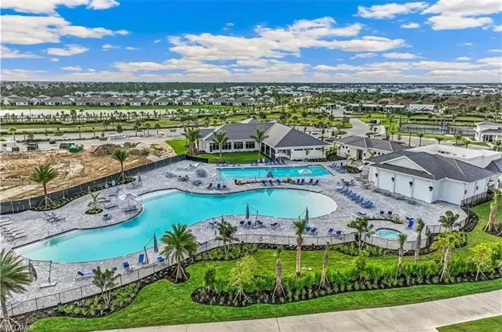 Aerial view of residential area featuring a pool